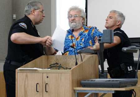 Novato Police Chief Joseph Kreins, left, and Captain J. Berg handcuff and arrest Jerome Ghigliotti of Novato for disrupting a public meeting, during discussion about the city's E-verify ballot measure Tuesday, September 14, 2010 at Novato City Council Chambers.  Nina Zhito / Special to the Marin Independent Journal